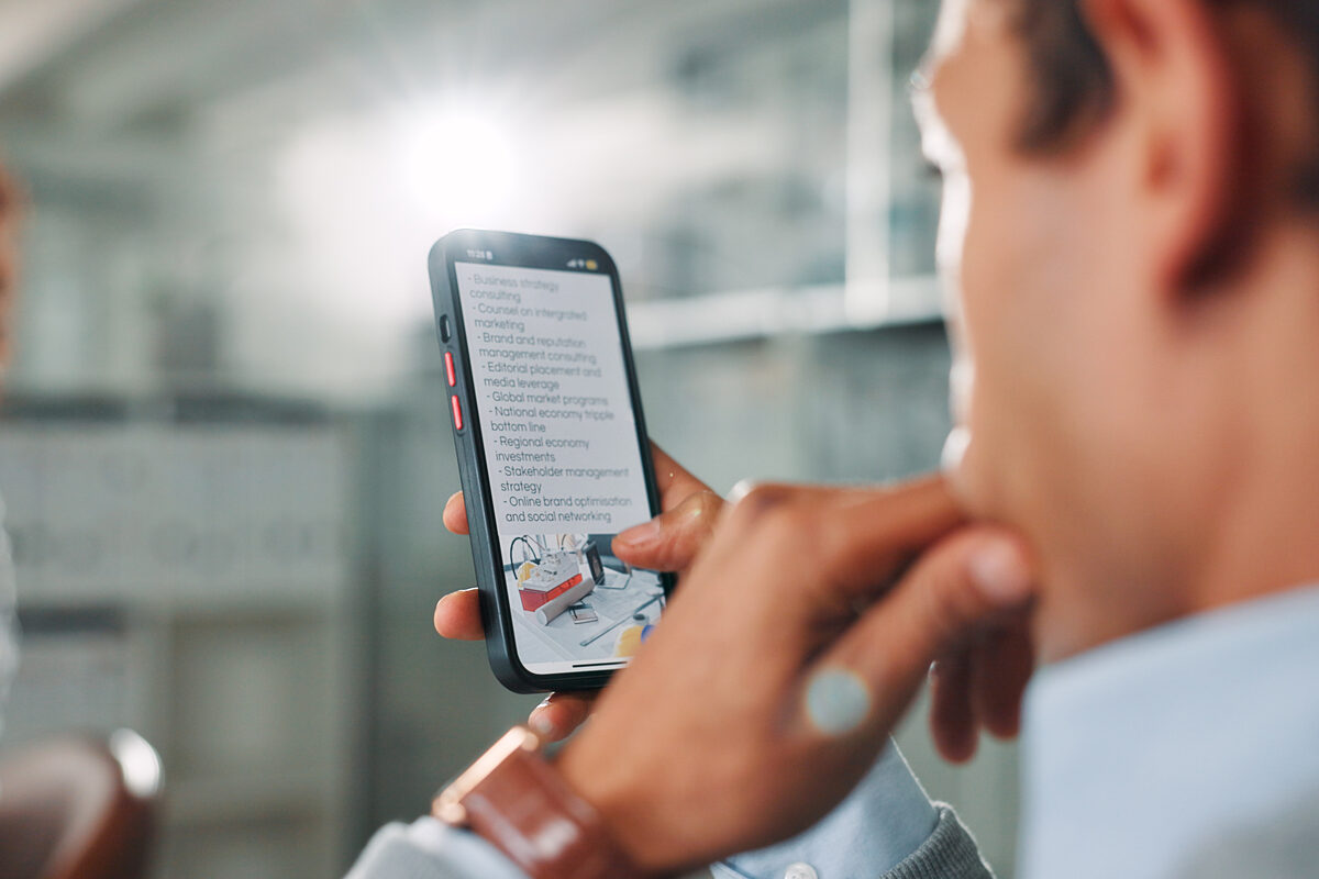 Developer replying to app store review notification on laptop screen