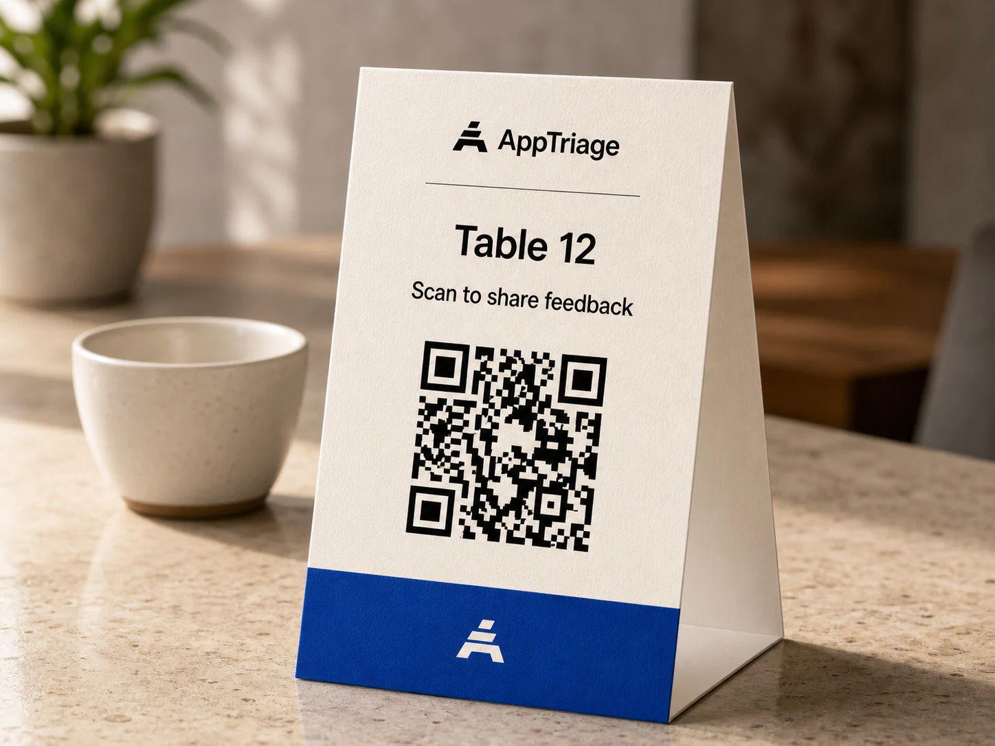 AppTriage QR feedback card on a cafe counter